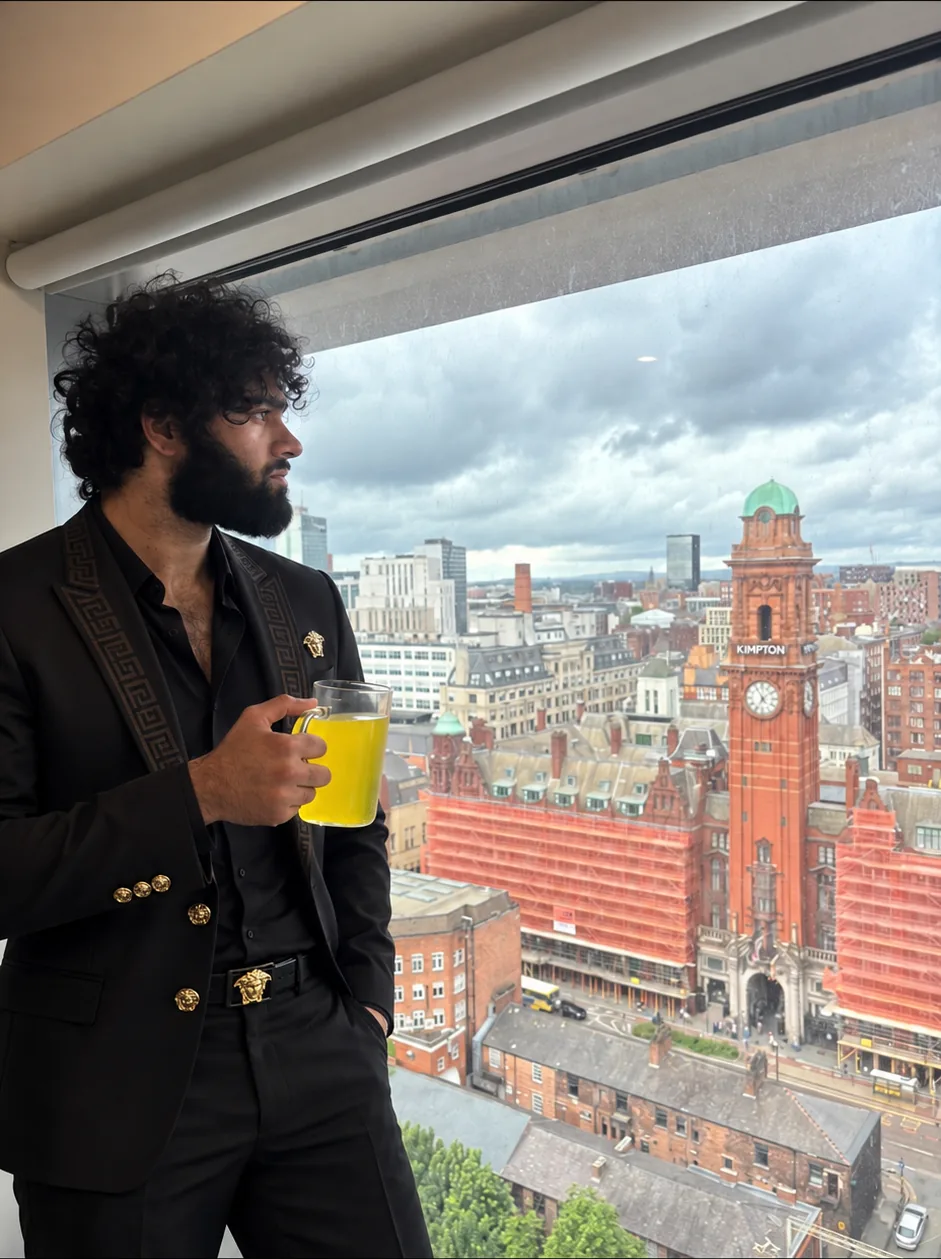 George Paliyil, founder of Setavo, at a window overlooking Manchester